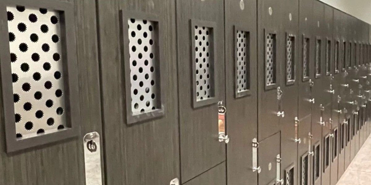 Row of dark gray lockers featuring rectangular, perforated metal ventilation panels.